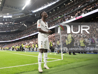 Vinicius Jr of Real Madrid celebrates a goal during the La Liga 2024/25 match between Real Madrid and Osasuna at Santiago Bernabeu Stadium i...