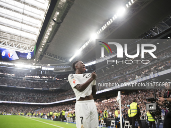 Vinicius Jr of Real Madrid celebrates a goal during the La Liga 2024/25 match between Real Madrid and Osasuna at Santiago Bernabeu Stadium i...