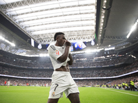 Vinicius Jr of Real Madrid celebrates a goal during the La Liga 2024/25 match between Real Madrid and Osasuna at Santiago Bernabeu Stadium i...