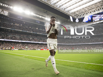 Vinicius Jr of Real Madrid celebrates a goal during the La Liga 2024/25 match between Real Madrid and Osasuna at Santiago Bernabeu Stadium i...