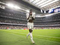 Vinicius Jr of Real Madrid celebrates a goal during the La Liga 2024/25 match between Real Madrid and Osasuna at Santiago Bernabeu Stadium i...