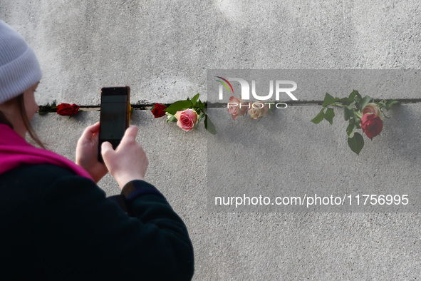 Flowers at Berlin Wall Memorial after the commemoration ceremony marking the 35th anniversary of the fall of the Berlin Wall. Berlin, German...