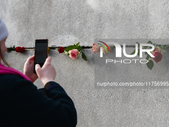 Flowers at Berlin Wall Memorial after the commemoration ceremony marking the 35th anniversary of the fall of the Berlin Wall. Berlin, German...