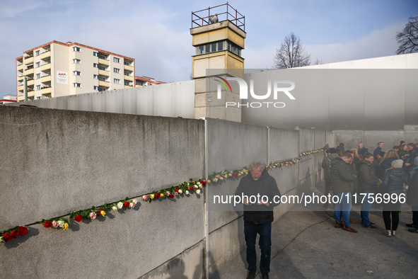 Flowers at Berlin Wall Memorial after the commemoration ceremony marking the 35th anniversary of the fall of the Berlin Wall. Berlin, German...