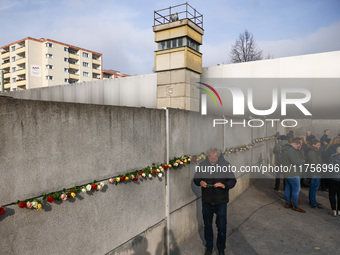 Flowers at Berlin Wall Memorial after the commemoration ceremony marking the 35th anniversary of the fall of the Berlin Wall. Berlin, German...