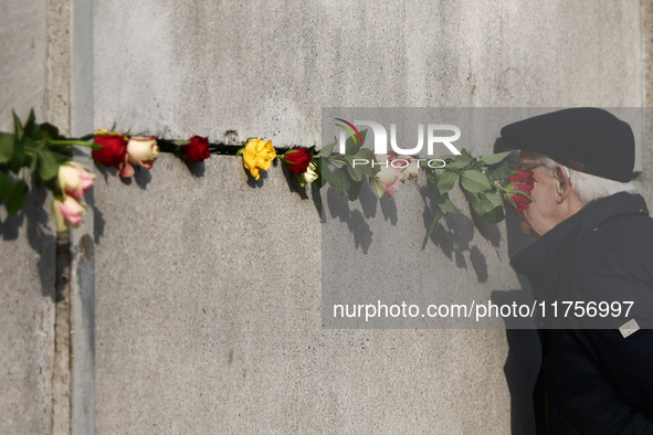 Flowers at Berlin Wall Memorial after the commemoration ceremony marking the 35th anniversary of the fall of the Berlin Wall. Berlin, German...