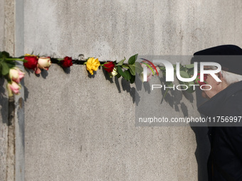 Flowers at Berlin Wall Memorial after the commemoration ceremony marking the 35th anniversary of the fall of the Berlin Wall. Berlin, German...