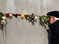 Flowers at Berlin Wall Memorial after the commemoration ceremony marking the 35th anniversary of the fall of the Berlin Wall. Berlin, German...