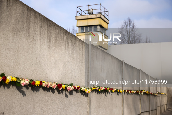 Flowers at Berlin Wall Memorial after the commemoration ceremony marking the 35th anniversary of the fall of the Berlin Wall. Berlin, German...