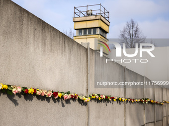 Flowers at Berlin Wall Memorial after the commemoration ceremony marking the 35th anniversary of the fall of the Berlin Wall. Berlin, German...