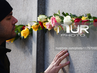 Flowers at Berlin Wall Memorial after the commemoration ceremony marking the 35th anniversary of the fall of the Berlin Wall. Berlin, German...