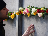 Flowers at Berlin Wall Memorial after the commemoration ceremony marking the 35th anniversary of the fall of the Berlin Wall. Berlin, German...