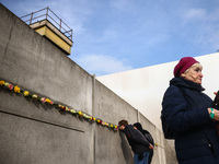 Flowers at Berlin Wall Memorial after the commemoration ceremony marking the 35th anniversary of the fall of the Berlin Wall. Berlin, German...