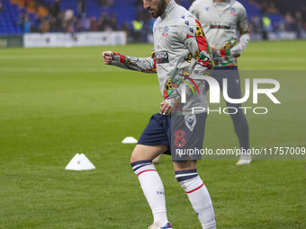 Josh Sheehan #8 of Bolton Wanderers F.C. warms up during the Sky Bet League 1 match between Stockport County and Bolton Wanderers at the Edg...