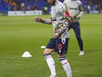 Josh Sheehan #8 of Bolton Wanderers F.C. warms up during the Sky Bet League 1 match between Stockport County and Bolton Wanderers at the Edg...