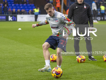 Szabolcs Schon #23 of Bolton Wanderers F.C. warms up during the Sky Bet League 1 match between Stockport County and Bolton Wanderers at the...