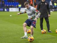 Szabolcs Schon #23 of Bolton Wanderers F.C. warms up during the Sky Bet League 1 match between Stockport County and Bolton Wanderers at the...