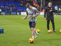 Szabolcs Schon #23 of Bolton Wanderers F.C. warms up during the Sky Bet League 1 match between Stockport County and Bolton Wanderers at the...