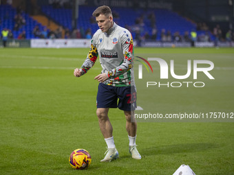 Szabolcs Schon #23 of Bolton Wanderers F.C. warms up during the Sky Bet League 1 match between Stockport County and Bolton Wanderers at the...