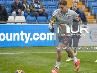 Dion Charles #10 of Bolton Wanderers F.C. warms up during the Sky Bet League 1 match between Stockport County and Bolton Wanderers at the Ed...