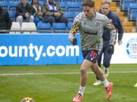 Dion Charles #10 of Bolton Wanderers F.C. warms up during the Sky Bet League 1 match between Stockport County and Bolton Wanderers at the Ed...