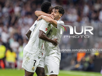 Vinicius Junior of Real Madrid CF (L) celebrates his goal with Brahim Diaz of Real Madrid CF (R) during the La Liga EA Sports 2024/25 footba...