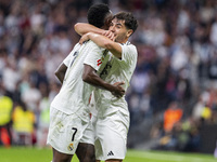 Vinicius Junior of Real Madrid CF (L) celebrates his goal with Brahim Diaz of Real Madrid CF (R) during the La Liga EA Sports 2024/25 footba...