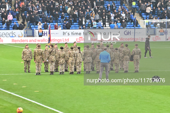 Remembrance with forces takes place during the Sky Bet League 1 match between Peterborough and Cambridge United at London Road in Peterborou...