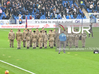 Remembrance with forces takes place during the Sky Bet League 1 match between Peterborough and Cambridge United at London Road in Peterborou...