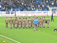 Remembrance with forces takes place during the Sky Bet League 1 match between Peterborough and Cambridge United at London Road in Peterborou...