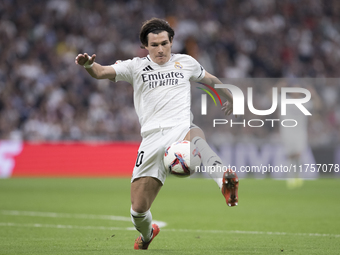 Fran Garcia of Real Madrid controls the ball during the La Liga 2024/25 match between Real Madrid and Osasuna at Santiago Bernabeu Stadium i...