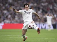 Fran Garcia of Real Madrid controls the ball during the La Liga 2024/25 match between Real Madrid and Osasuna at Santiago Bernabeu Stadium i...