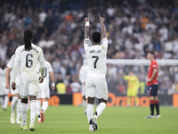 Vinicius Jr of Real Madrid celebrates a goal during the La Liga 2024/25 match between Real Madrid and Osasuna at Santiago Bernabeu Stadium i...