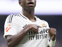 Vinicius Jr of Real Madrid celebrates a goal during the La Liga 2024/25 match between Real Madrid and Osasuna at Santiago Bernabeu Stadium i...