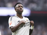 Vinicius Jr of Real Madrid celebrates a goal during the La Liga 2024/25 match between Real Madrid and Osasuna at Santiago Bernabeu Stadium i...