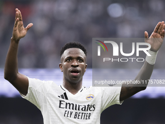 Vinicius Jr of Real Madrid celebrates a goal during the La Liga 2024/25 match between Real Madrid and Osasuna at Santiago Bernabeu Stadium i...