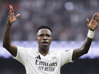 Vinicius Jr of Real Madrid celebrates a goal during the La Liga 2024/25 match between Real Madrid and Osasuna at Santiago Bernabeu Stadium i...