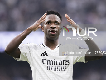 Vinicius Jr of Real Madrid celebrates a goal during the La Liga 2024/25 match between Real Madrid and Osasuna at Santiago Bernabeu Stadium i...