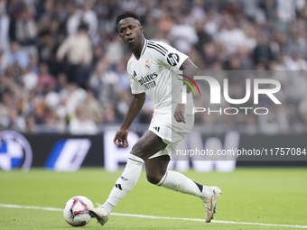 Vinicius Jr of Real Madrid scores a goal during the La Liga 2024/25 match between Real Madrid and Osasuna at Santiago Bernabeu Stadium in Ma...