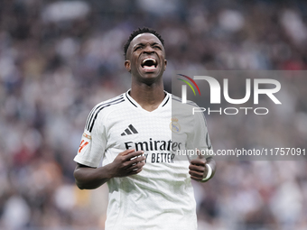 Vinicius Jr of Real Madrid reacts to a missed opportunity during the La Liga 2024/25 match between Real Madrid and Osasuna at Santiago Berna...