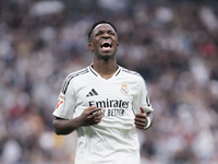 Vinicius Jr of Real Madrid reacts to a missed opportunity during the La Liga 2024/25 match between Real Madrid and Osasuna at Santiago Berna...