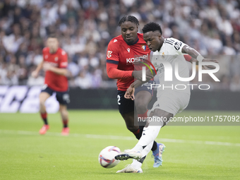 Vinicius Jr of Real Madrid attempts a shot during the La Liga 2024/25 match between Real Madrid and Osasuna at Santiago Bernabeu Stadium in...