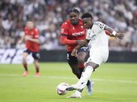 Vinicius Jr of Real Madrid attempts a shot during the La Liga 2024/25 match between Real Madrid and Osasuna at Santiago Bernabeu Stadium in...