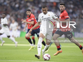 Kylian Mbappe of Real Madrid plays during the La Liga 2024/25 match between Real Madrid and Osasuna at Santiago Bernabeu Stadium in Madrid,...