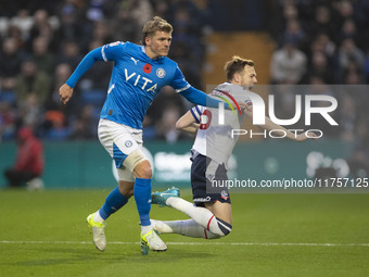 George Johnston #6 of Bolton Wanderers F.C. is fouled by the opponent during the Sky Bet League 1 match between Stockport County and Bolton...