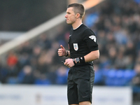 Referee Edward Duckworth observes during the Sky Bet League 1 match between Peterborough and Cambridge United at London Road in Peterborough...