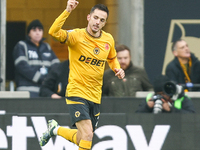 Pablo Sarabia of Wolves raises his hand in celebration following his goal during the Premier League match between Wolverhampton Wanderers an...