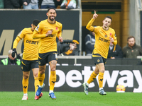 Pablo Sarabia of Wolves raises his hand in celebration following his goal during the Premier League match between Wolverhampton Wanderers an...