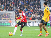 Kyle Walker-Peters of Southampton is in attacking action as Rayan Ait-Nouri of Wolves shadows during the Premier League match between Wolver...