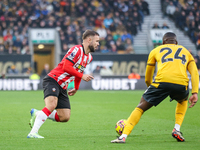 Number 9, Adam Armstrong of Southampton, is in attacking action during the Premier League match between Wolverhampton Wanderers and Southamp...